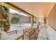 Relaxing covered patio featuring comfortable seating, creating a perfect spot for outdoor enjoyment and entertaining at 2056 Oliver Springs St, Henderson, NV 89052