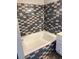 Stylish bathroom featuring a tiled tub surround, white fixtures, and modern design elements at 2200 S Fort Apache Rd # 2071, Las Vegas, NV 89117