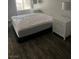 Simple bedroom with a queen bed, two bedside tables, and decorative lamps; a peaceful retreat for relaxation at 2200 S Fort Apache Rd # 2071, Las Vegas, NV 89117