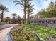 Beautiful community entrance with lush landscaping and the Residence at Canyon Gate sign creates a welcoming atmosphere at 2200 S Fort Apache Rd # 2071, Las Vegas, NV 89117