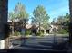 Gated entrance leading to residences with lush landscaping and mature trees for added privacy at 2200 S Fort Apache Rd # 2071, Las Vegas, NV 89117