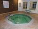 Indoor community hot tub with stone surround, perfect for relaxing after a long day at 2200 S Fort Apache Rd # 2071, Las Vegas, NV 89117
