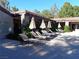 Community pool deck with comfortable lounge chairs and shaded umbrellas at 2200 S Fort Apache Rd # 2071, Las Vegas, NV 89117