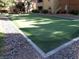 Well-maintained putting green surrounded by rocks and landscaping for relaxing recreation at 2200 S Fort Apache Rd # 2071, Las Vegas, NV 89117