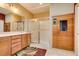 Bathroom featuring a stand up shower, sauna, and wooden cabinets at 2240 Cordaville Dr, Henderson, NV 89044