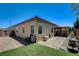 Spacious backyard featuring a patio, artificial turf, and plenty of room for outdoor activities at 2425 Amatrice St, Henderson, NV 89044