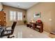 Comfortable bedroom features neutral walls, shutters, and tile flooring at 2425 Amatrice St, Henderson, NV 89044