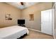 Bedroom featuring neutral decor, plush carpet, and an open doorway at 2425 Amatrice St, Henderson, NV 89044