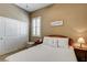Relaxing bedroom with white linens, plantation shutters, and decorative wall art at 2425 Amatrice St, Henderson, NV 89044