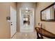 Elegant entryway features neutral walls, sleek tile flooring, and decorative lighting at 2425 Amatrice St, Henderson, NV 89044