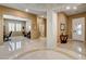 Spacious foyer features an open floor plan with neutral colors and tile floors at 2425 Amatrice St, Henderson, NV 89044