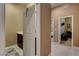Hallway view to a vanity area and a bedroom at 2425 Amatrice St, Henderson, NV 89044