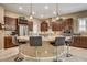 Kitchen with island, bar seating, and stainless-steel appliances at 2425 Amatrice St, Henderson, NV 89044