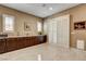 Additional living area, featuring built in cabinets and shuttered windows, ideal for entertaining or relaxation at 2425 Amatrice St, Henderson, NV 89044