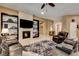 Inviting living room featuring a fireplace, built-in shelving, and comfortable seating, creating a cozy atmosphere at 2425 Amatrice St, Henderson, NV 89044