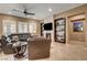 Living room features a fireplace, built-in shelving, and plantation shutters at 2425 Amatrice St, Henderson, NV 89044