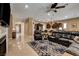 Expansive living space showcasing an open layout, seamlessly connecting the living room, dining area, and kitchen at 2425 Amatrice St, Henderson, NV 89044