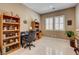 Bright office space with tiled floors, natural light, and custom built-in shelving for storage at 2425 Amatrice St, Henderson, NV 89044