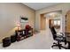 Cozy office nook with desk, display shelves, and an open view into the dining area at 2425 Amatrice St, Henderson, NV 89044