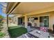 Inviting covered patio with a table and seating, perfect for outdoor relaxation and entertaining at 2425 Amatrice St, Henderson, NV 89044