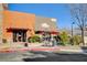 Attractive exterior of a Romano's restaurant featuring outdoor seating and inviting ambiance in a commercial center at 2425 Amatrice St, Henderson, NV 89044