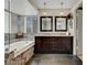 Luxurious bathroom with double sink vanity, soaking tub with granite surround, and modern lighting at 2429 Sun Shores Dr, Las Vegas, NV 89128