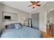 Bedroom features vaulted ceilings, ceiling fan, natural light, and a mirror at 2429 Sun Shores Dr, Las Vegas, NV 89128