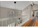 Second story hallway showcasing hardwood floors, natural light, and stairwell at 2429 Sun Shores Dr, Las Vegas, NV 89128