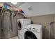 Laundry room features front load washer and dryer and wire shelving at 2429 Sun Shores Dr, Las Vegas, NV 89128