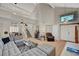 Inviting living room featuring soaring ceilings, tile floors, neutral walls, and an open concept design at 2429 Sun Shores Dr, Las Vegas, NV 89128