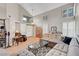 Inviting living room featuring soaring ceilings, tile floors, neutral walls, and an open concept design at 2429 Sun Shores Dr, Las Vegas, NV 89128