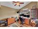 Bright, well-lit office with built-in shelving, three monitors, and a window at 2429 Sun Shores Dr, Las Vegas, NV 89128