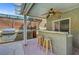 Spacious outdoor kitchen with a built-in grill, bar seating, and ample counter space for entertaining at 2429 Sun Shores Dr, Las Vegas, NV 89128