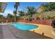 Sparkling pool with brick accents and lovely landscaping, a great spot for relaxation and fun at 2429 Sun Shores Dr, Las Vegas, NV 89128