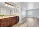 Well-lit bathroom featuring a granite countertop and modern gray flooring at 2451 N Rainbow Blvd # 2144, Las Vegas, NV 89108