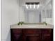 Close-up of the bathroom vanity featuring granite countertop, stylish lighting, and modern fixtures at 2451 N Rainbow Blvd # 2144, Las Vegas, NV 89108