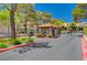 Gated community entrance with a security booth, providing residents with privacy, security, and peace of mind at 2451 N Rainbow Blvd # 2144, Las Vegas, NV 89108