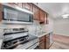 Modern kitchen with stainless steel appliances, a double sink, and ample counter space for food preparation at 2451 N Rainbow Blvd # 2144, Las Vegas, NV 89108