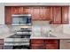 Modern kitchen with stainless steel appliances, a double sink, and ample counter space for food preparation at 2451 N Rainbow Blvd # 2144, Las Vegas, NV 89108