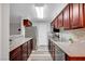 Well-lit kitchen features stainless steel appliances, granite countertops, and wood cabinets at 2451 N Rainbow Blvd # 2144, Las Vegas, NV 89108
