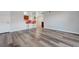 Bright and airy living room with wood-look floors and a wet bar with red chairs at 2451 N Rainbow Blvd # 2144, Las Vegas, NV 89108