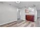 Open living space boasts wood floors and a bar area with attractive wood cabinetry at 2451 N Rainbow Blvd # 2144, Las Vegas, NV 89108