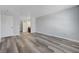 Open-concept living room with wood floors and access to the bathroom at 2451 N Rainbow Blvd # 2144, Las Vegas, NV 89108