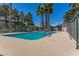 Large community pool provides plenty of swimming space with mature landscaping and fencing at 2451 Old Forge Ln # 105, Las Vegas, NV 89121