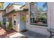 The home's front entrance has a decorative wreath, security door, and a covered entryway at 2451 Old Forge Ln # 105, Las Vegas, NV 89121