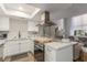 Bright, modern kitchen with stainless appliances, white cabinetry and natural light at 2451 Old Forge Ln # 105, Las Vegas, NV 89121