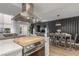 Modern kitchen and dining area blend seamlessly with a view into the bright living space at 2451 Old Forge Ln # 105, Las Vegas, NV 89121