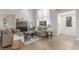 Cozy living room with fireplace, stylish decor, and seamless transition to entry at 2451 Old Forge Ln # 105, Las Vegas, NV 89121