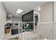 View of loft featuring textured accent wall, couch, chair, desk and skylight at 2451 Old Forge Ln # 105, Las Vegas, NV 89121