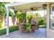 Cozy back patio with outdoor seating, perfect for enjoying a meal or relaxing in the backyard at 2708 Norbeck St, Las Vegas, NV 89117